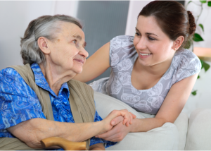 caregiver with elderly patient at the nursing home