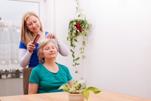 caregiver combing her patient