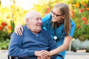 young doctor with elderly patient at the nursing home