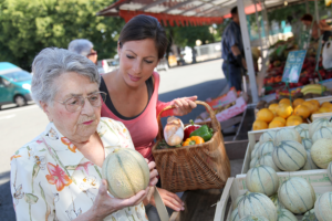 caregiver with his patient buying goods in the market